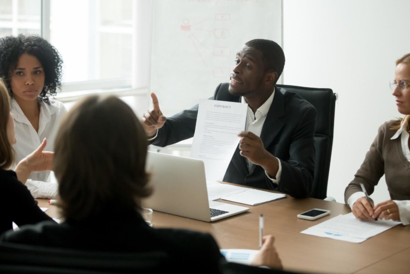 people discussing the construction contract