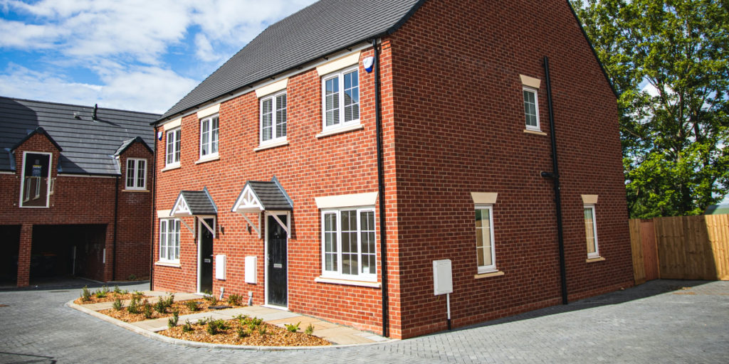 A newbuild house with red brick
